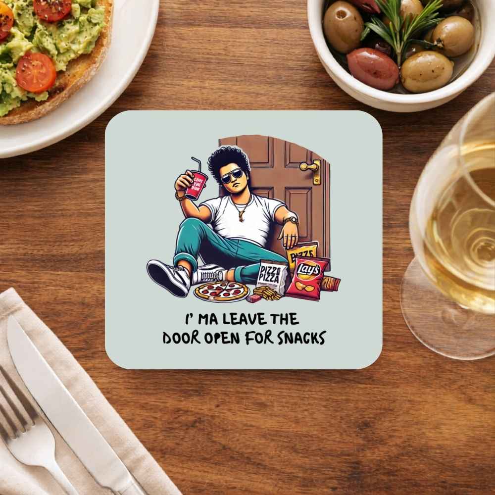 Coaster with a cartoon character sitting on a door, surrounded by snacks and drinks, on a wooden table. Bruno Mars Gift The Banyan Tee India