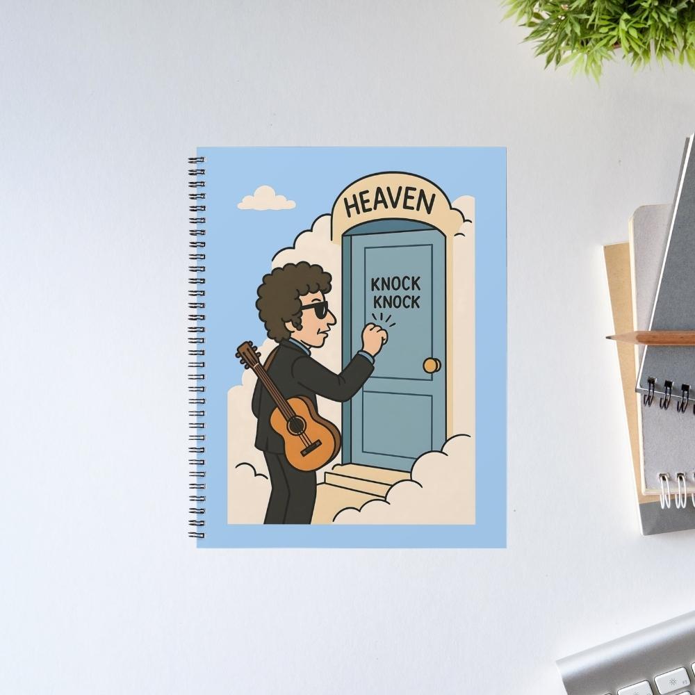 Notebook with a cartoon illustration of a person with a guitar knocking on a door labeled 'Heaven' on a light blue background. Bob Dylan
