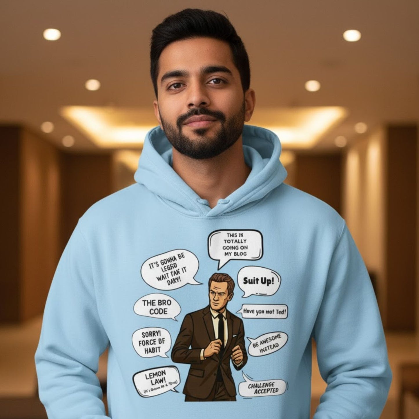 Man wearing a light blue hoodie with graphic design and text bubbles. Barney How I Met Your Mother