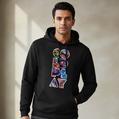 Man wearing a black hoodie with colorful text design on a neutral background