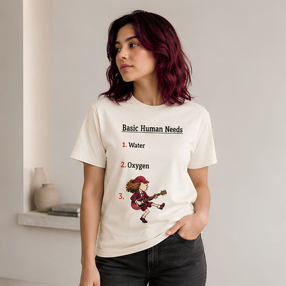 Person wearing a t-shirt with 'Basic Human Needs' graphic design. AC/DC t-shirt off white The Banyan tee