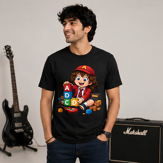 Man wearing a black t-shirt with a cartoon character design, standing in front of a Marshall amplifier and guitar. AC/DC t-shirt The Banyan Tee India