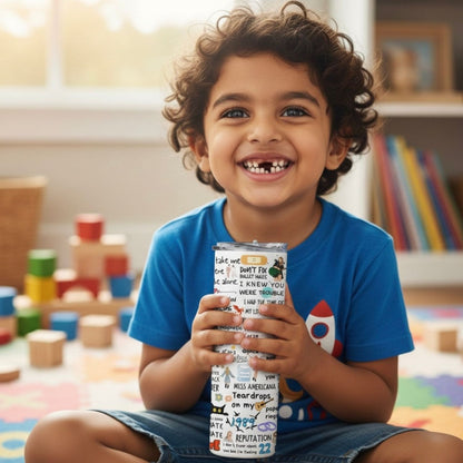 Child holding a Taylor Swift TUmbler Bottle  in a room with toys and books 