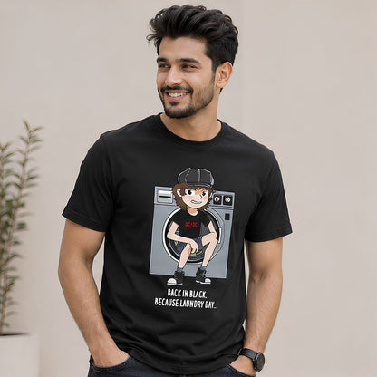 Man wearing a black t-shirt with a graphic design of a person in a washing machine and text. AC/DC t-shirt The Banyan Tee India