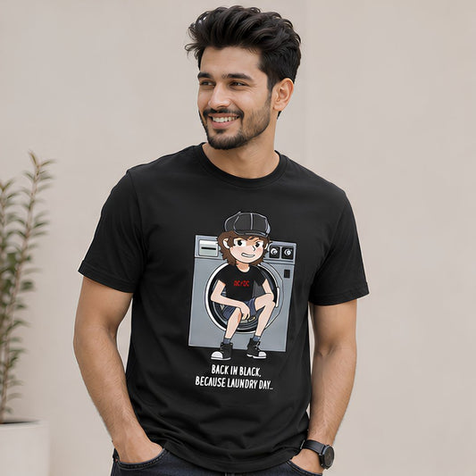 Man wearing a black t-shirt with a graphic design of a person in a washing machine and text. AC/DC t-shirt The Banyan Tee India