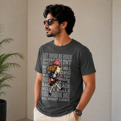 Man wearing a dark gray t-shirt with graphic design and text, standing against a plain wall.