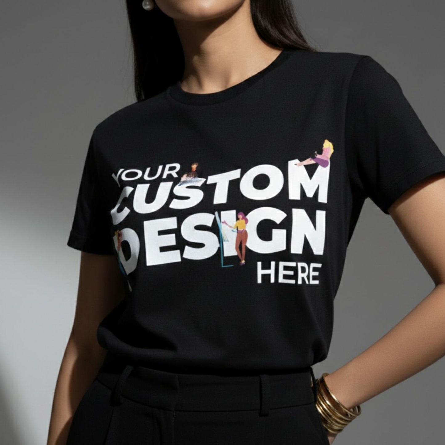 Black t-shirt with 'Your Custom Design Here' text and graphics on a gray background