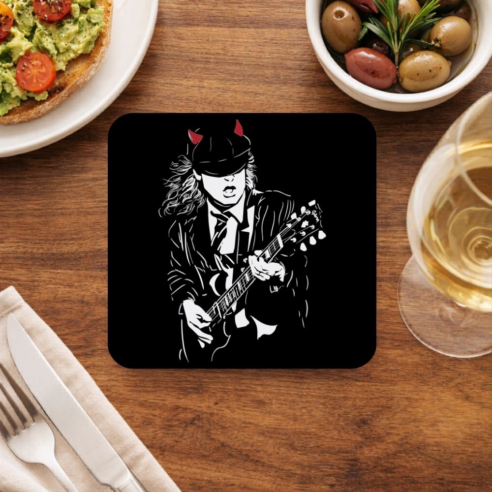 Coaster with a graphic of a musician playing guitar on a wooden table with food and drink. AC/DC coaster The Banyan Tee