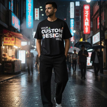 Man wearing a black t-shirt with customizable text in an urban night setting