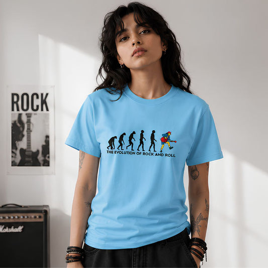 Person wearing a blue t-shirt with 'The Evolution of Rock and Roll' design, standing in a room with a guitar and amplifier. AC/DC t-shirt The Banyan Tee India