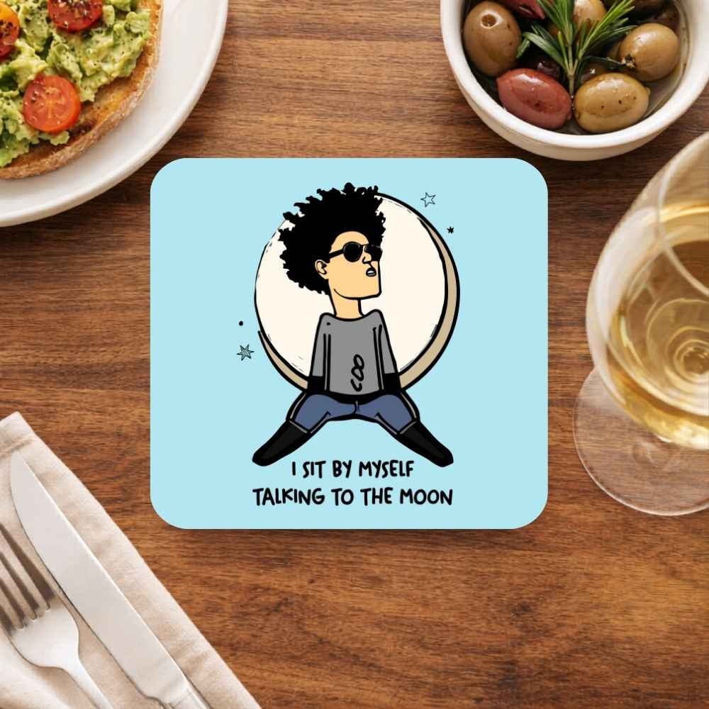 Coaster with a cartoon character and text on a table with food and drink. Bruno Mars Gift The Banyan Tee India