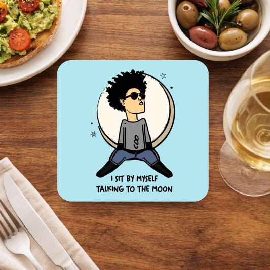 Coaster with a cartoon character and text on a table with food and drink. Bruno Mars Gift The Banyan Tee India