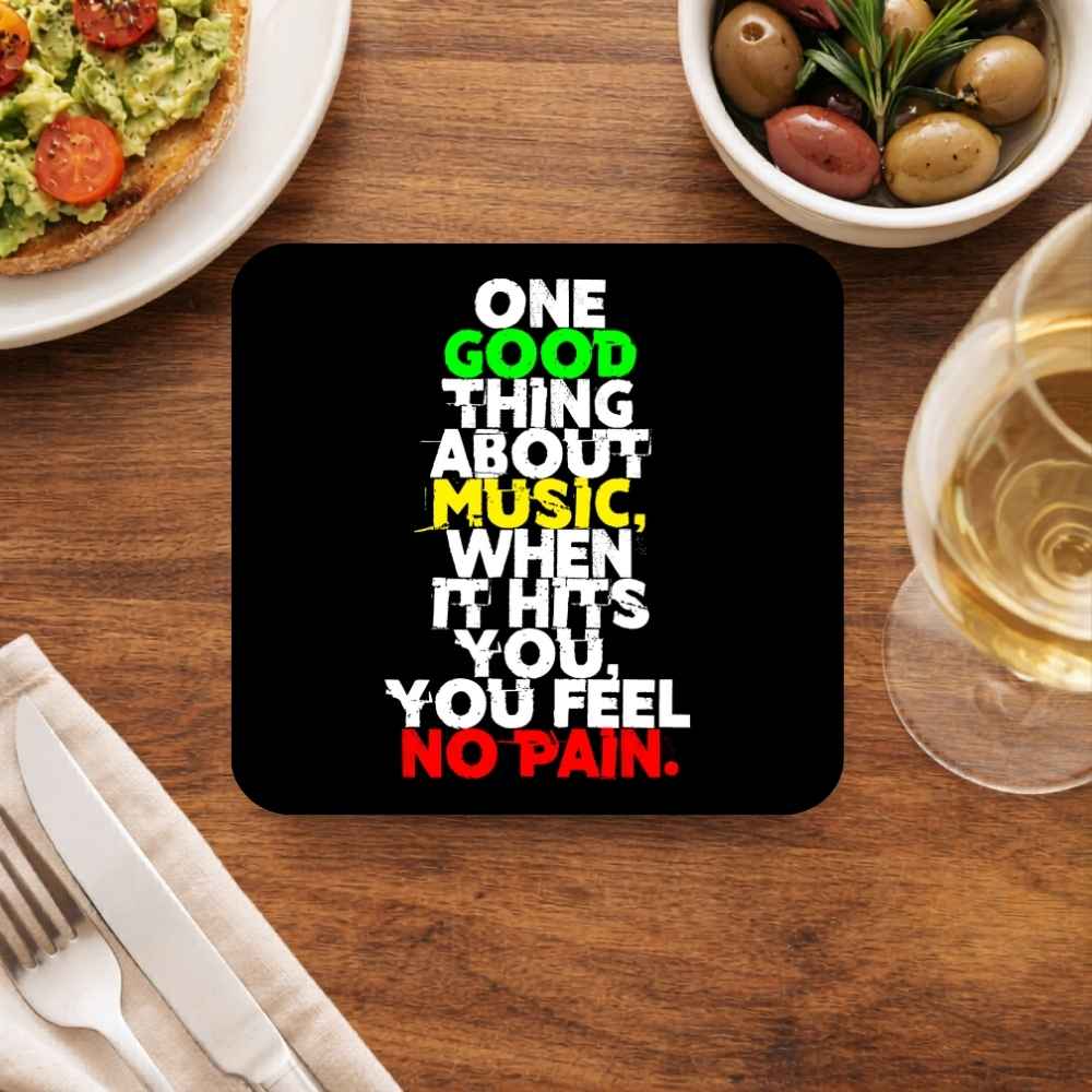 Coaster with a humorous quote on a dining table with food and drink. Bob Marley