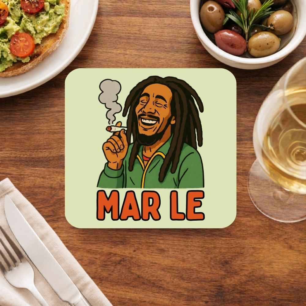 Coaster with a cartoon character and 'MAR LE' text on a wooden table with food and drink. Bob Marley