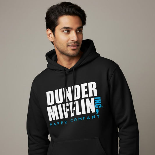 Man wearing a black hoodie with 'Dunder Mifflin Paper Company' text on a plain background