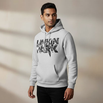 Man wearing a gray hoodie with 'Linkin Park' logo on a beige background