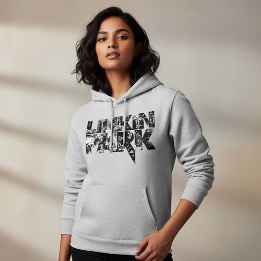 Woman wearing a gray hoodie with 'Linkin Park' text design on a neutral background