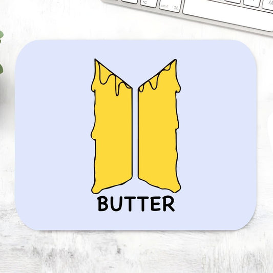 BTS Butter Mousepad – Large gaming desk mat with melting butter BTS logo illustration on pastel blue background, smooth moves K-pop fan accessory, Bangtan Boys merch, The Banyan Tee India
