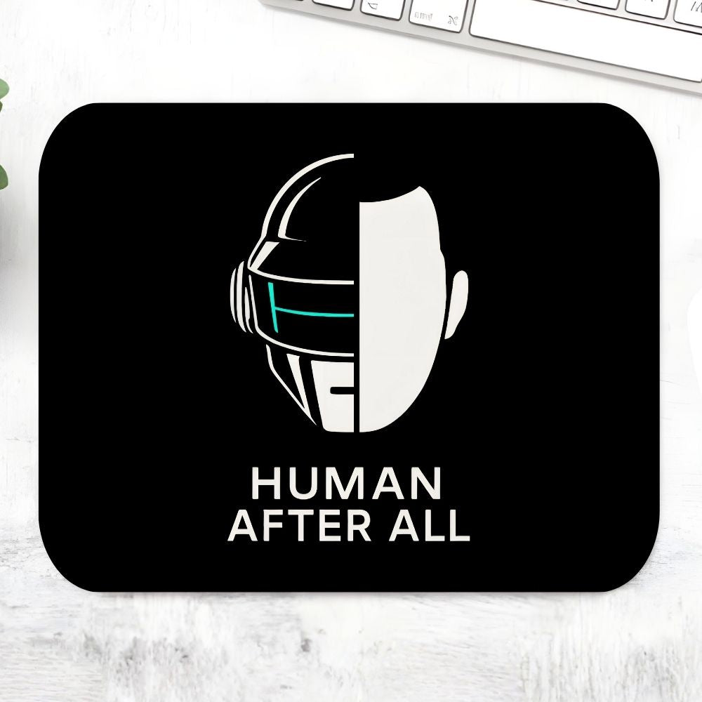 Mouse pad with a robot head design and 'Human After All' text on a white surface. Daft Punk The Banyan Tee