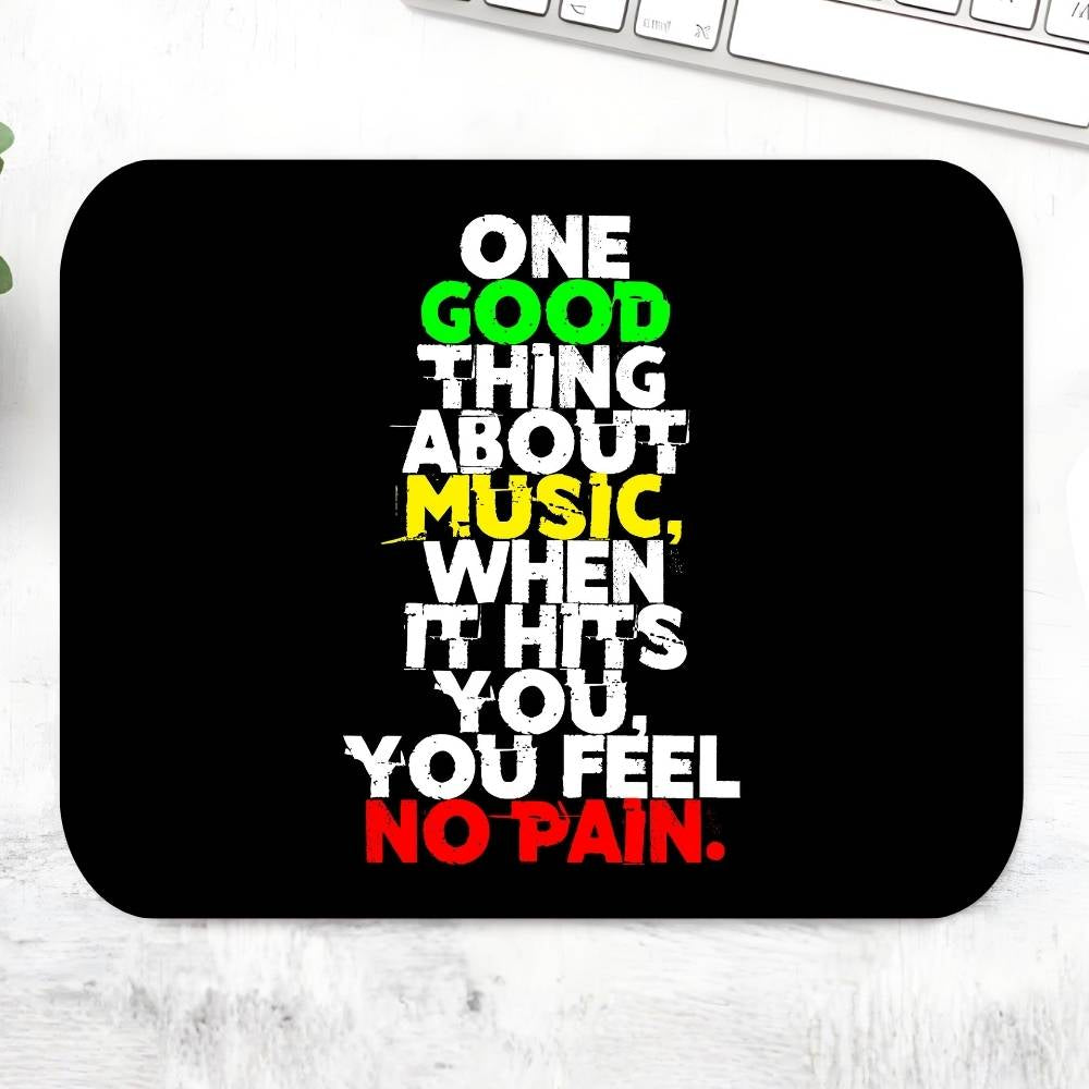 Black mouse pad with colorful text quote on a white surface Bob Marley