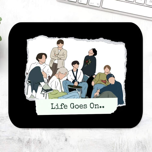 BTS Life Goes On Mousepad – Black large desk mat with hand-drawn BTS member illustrations and Life Goes On lyric typography, K-pop fan desk accessory, Bangtan Boys merch, The Banyan Tee