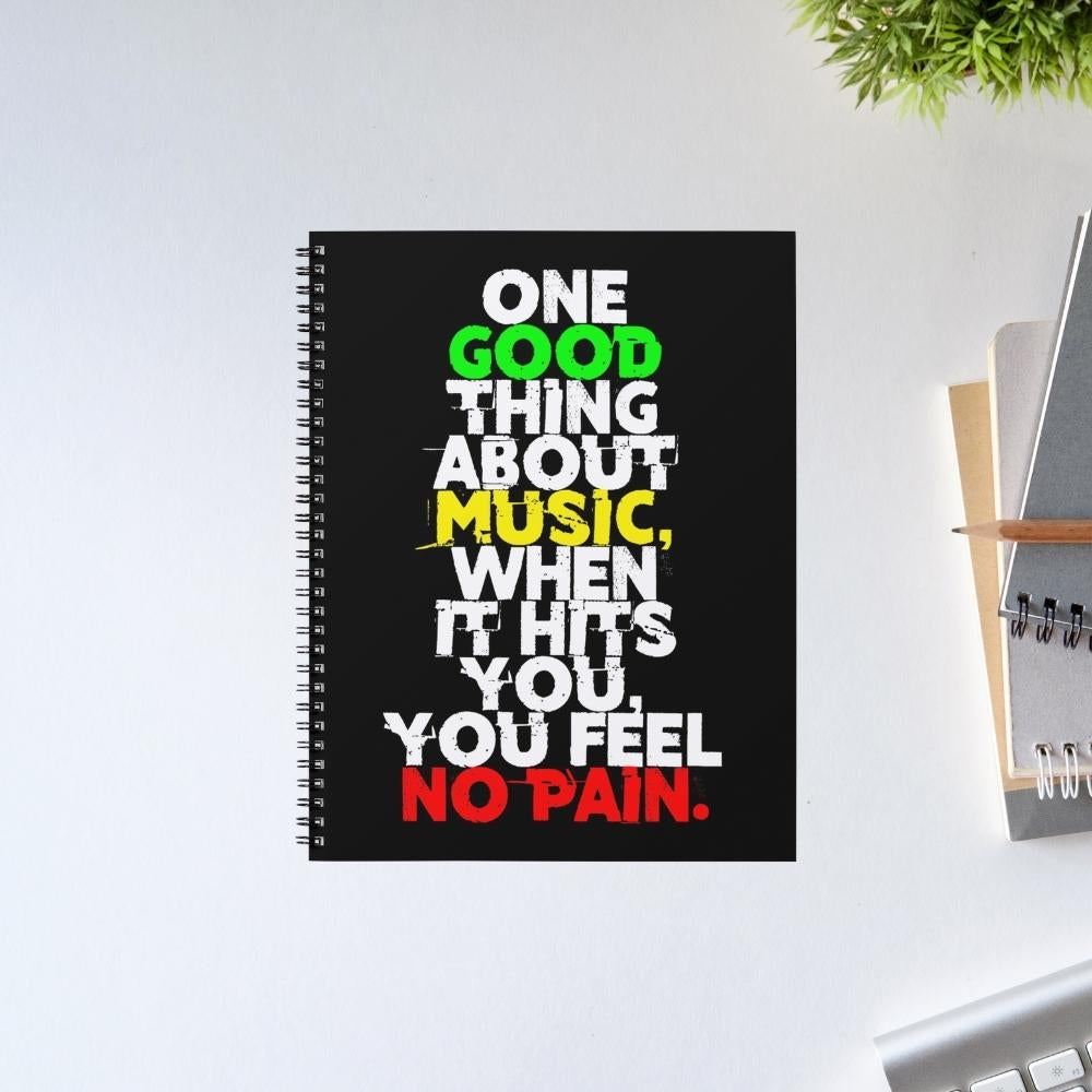 Notebook with motivational quote on a white surface Bob Marley