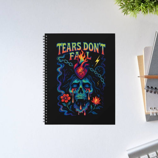 Notebook with colorful skull design and 'Tears Don't Fail' text on a white surface. Bullet for my valentine.
