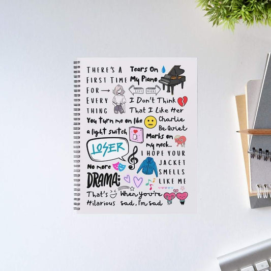Charlie's Chart Toppers Notebook – A5 spiral journal with illustrated Charlie Puth song lyric doodle art cover featuring Attention Loser We Don't Talk Anymore, pop music fan stationery gift, The Banyan Tee