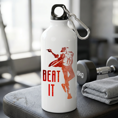 Beat It metal sipper bottle on a gym bench beside dumbbells and a towel