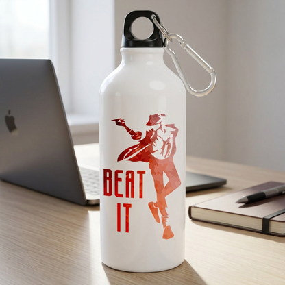 Beat It metal sipper bottle on an office desk beside a laptop and notebook
