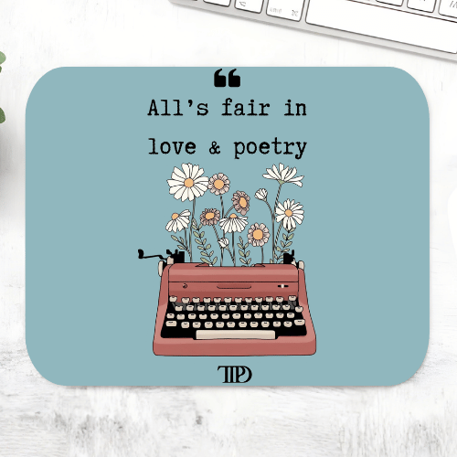 Taylor Swift Love & Poetry mousepad with the line 'All's fair in love & poetry' above a pink typewriter sprouting daisies and a TTPD logo on a dusty blue mouse pad – non-slip desk mouse mat, The Banyan Tee