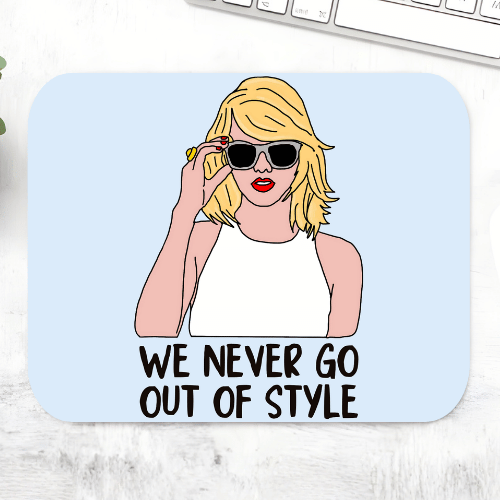 Taylor Swift Style mousepad with an illustrated blonde woman in sunglasses and the line 'We never go out of style' on a light blue mouse pad – non-slip desk mouse mat, The Banyan Tee