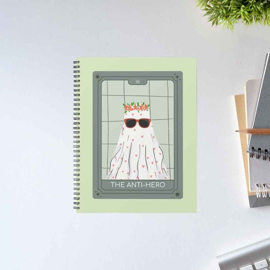 Taylor Swift The Anti-Hero spiral notebook with a tarot-style card of a ghost in sunglasses and a flower crown on a sage green cover – unruled notepad diary, The Banyan Tee