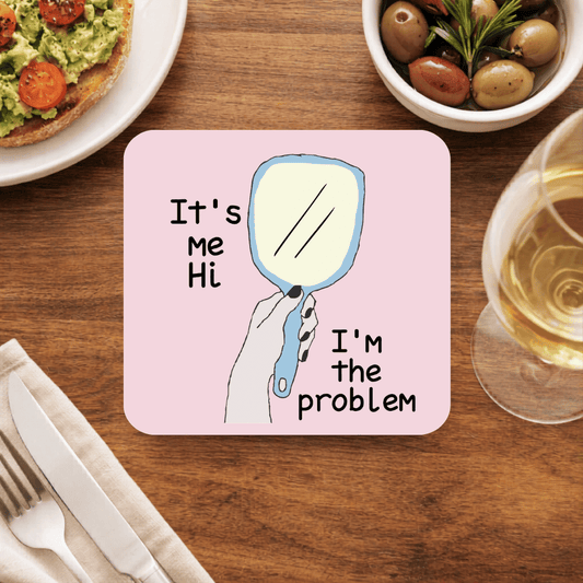 Taylor Swift Anti-Hero coaster, pale pink with a hand holding a blue hand mirror and the words It's me, hi, I'm the problem